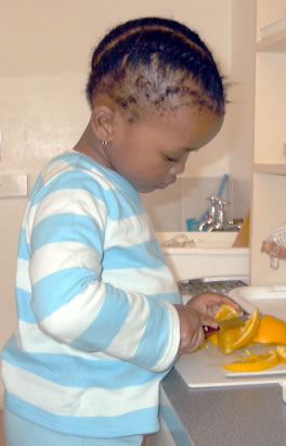 Child in a Montessori kitchen